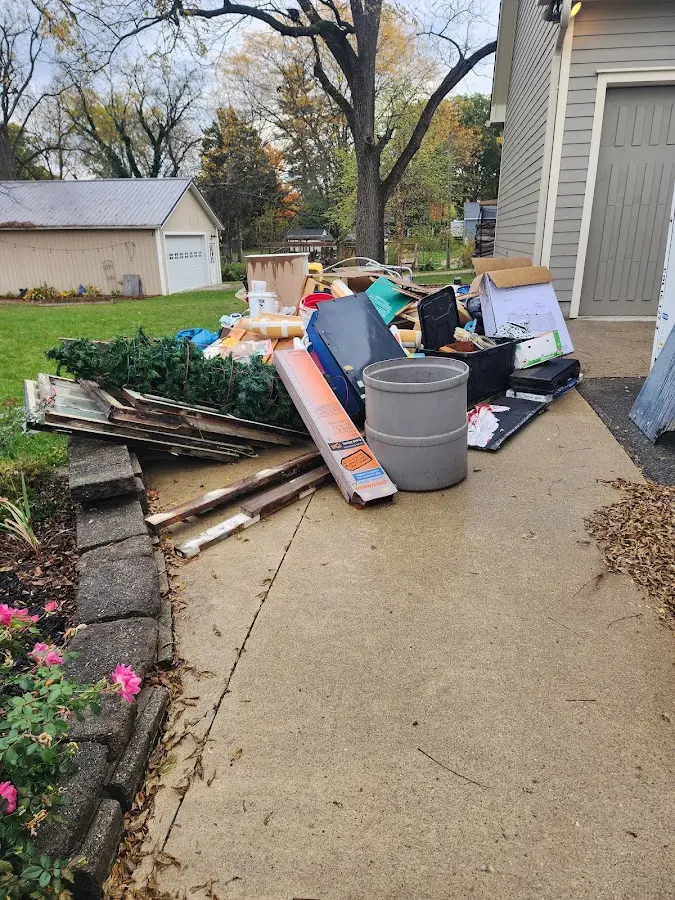 Dumpster being loaded with debris for 30 Yard Dumpster Rental in Umatilla
